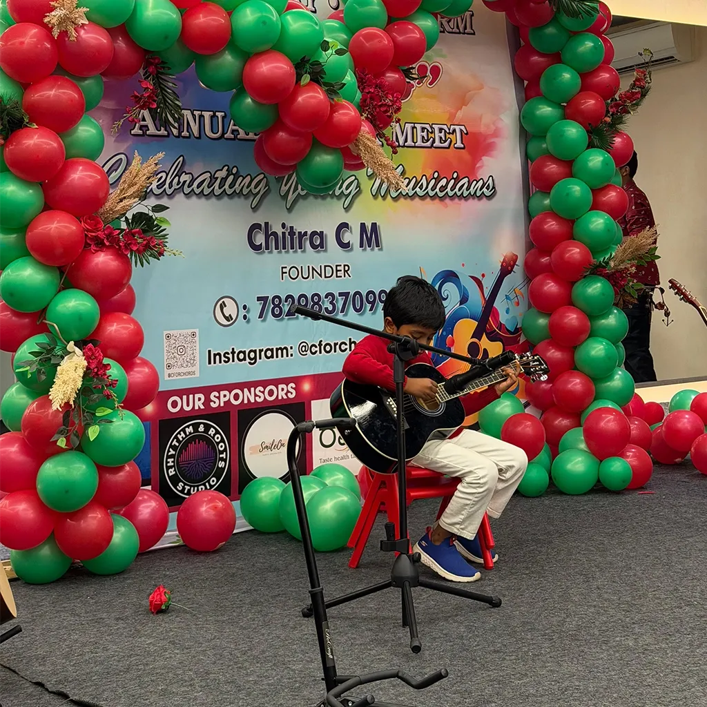 A young guitarist performing at the annual showcase